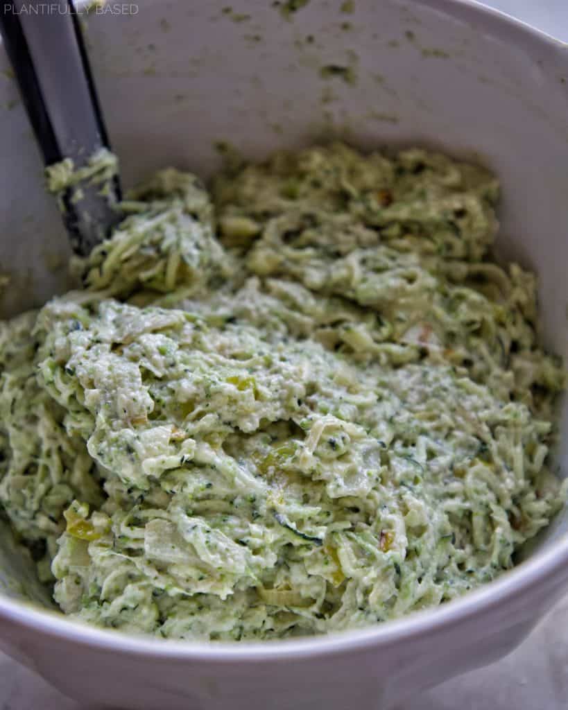 savory zucchini bread batter in mixing bowl