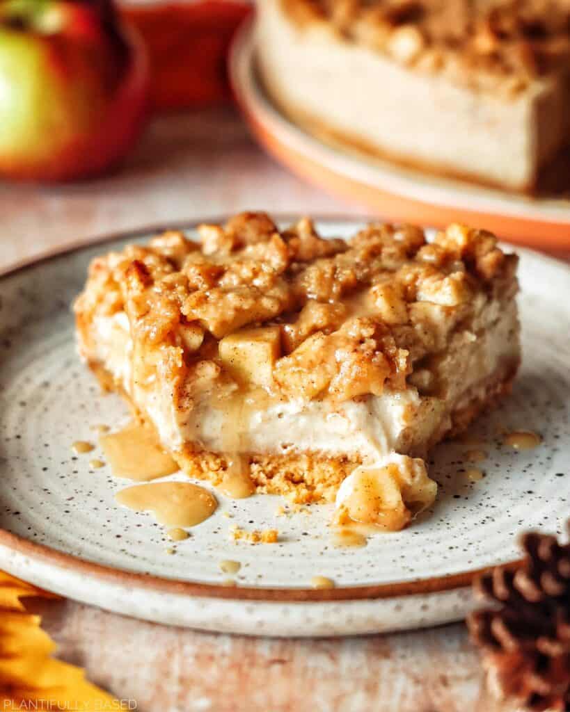 image of apple crumble cheesecake with piece taken out to show inside