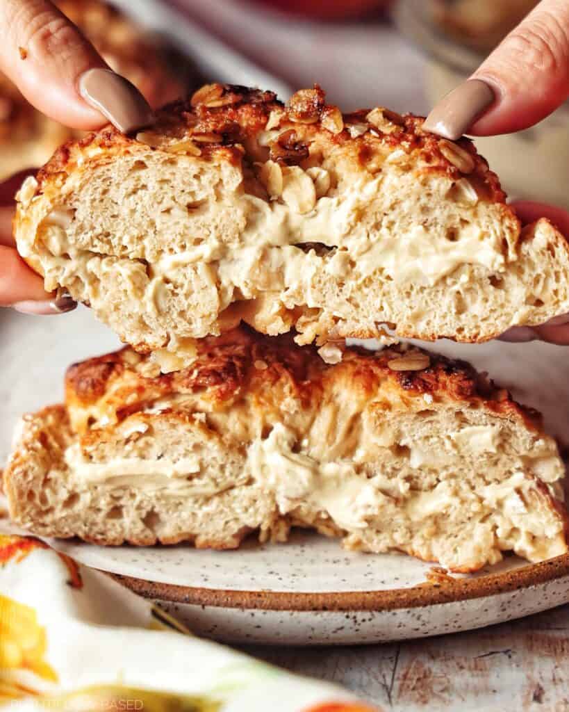 image of high protein apple crisp bagel cut in half with vegan cream cheese