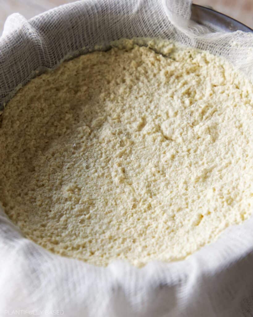 image of vegan curds in cheesecloth