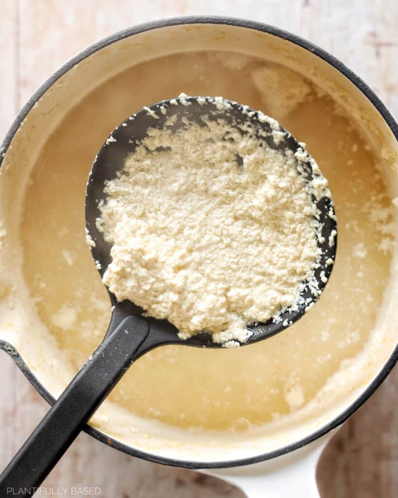 image of vegan curds being scooped