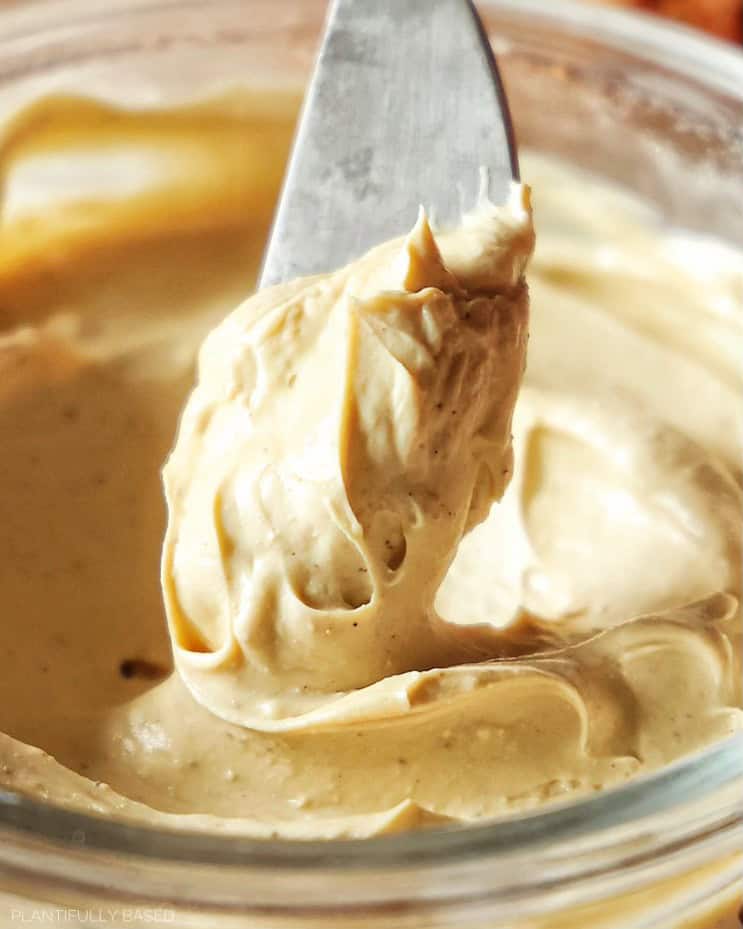 image of maple cream cheese being scooped with a spreader