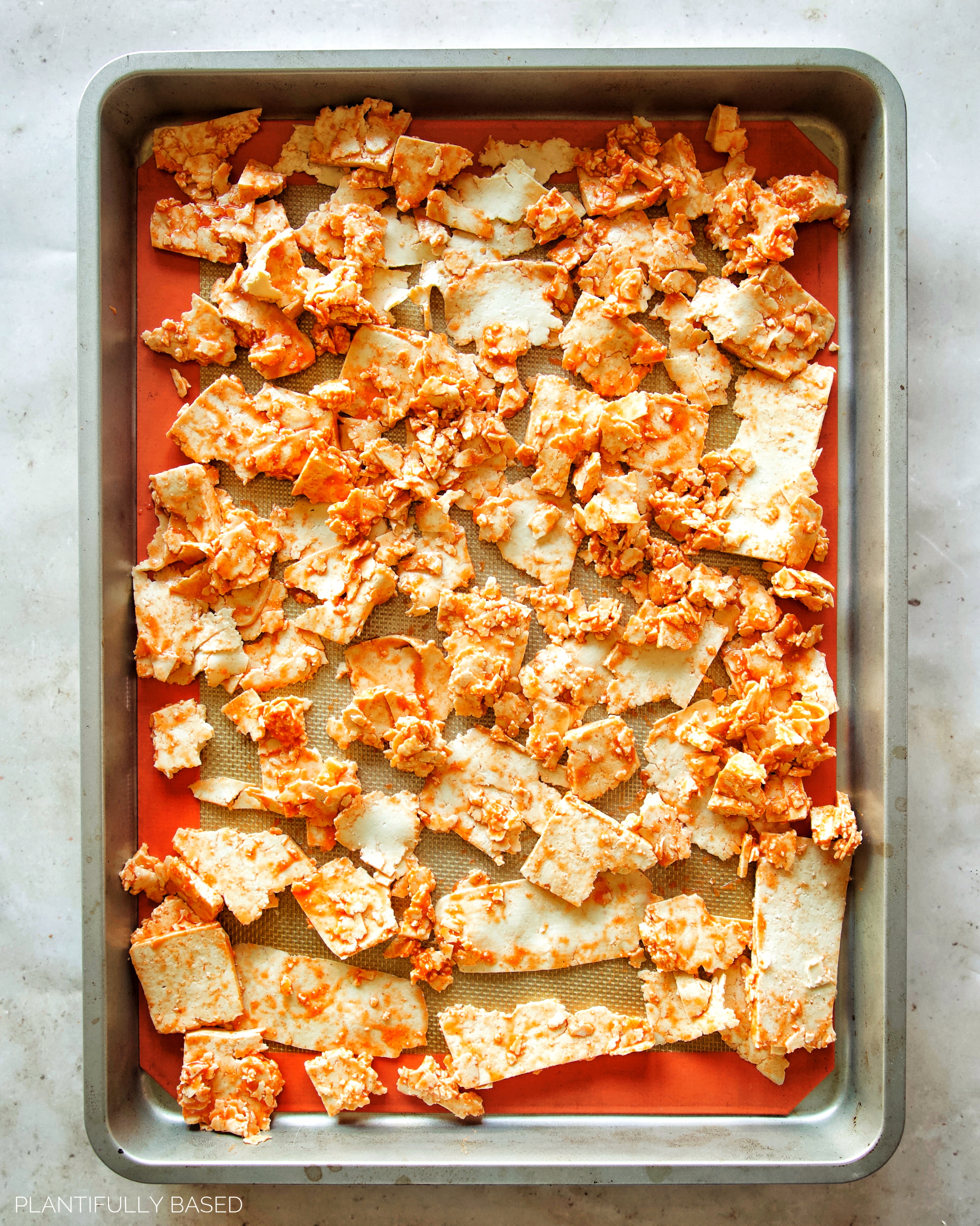 buffalo tofu lunch meat on baking sheet