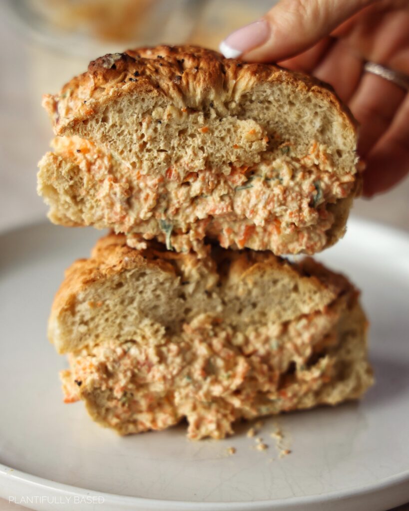 image of vegan veggie cream cheese on bagel cut in half