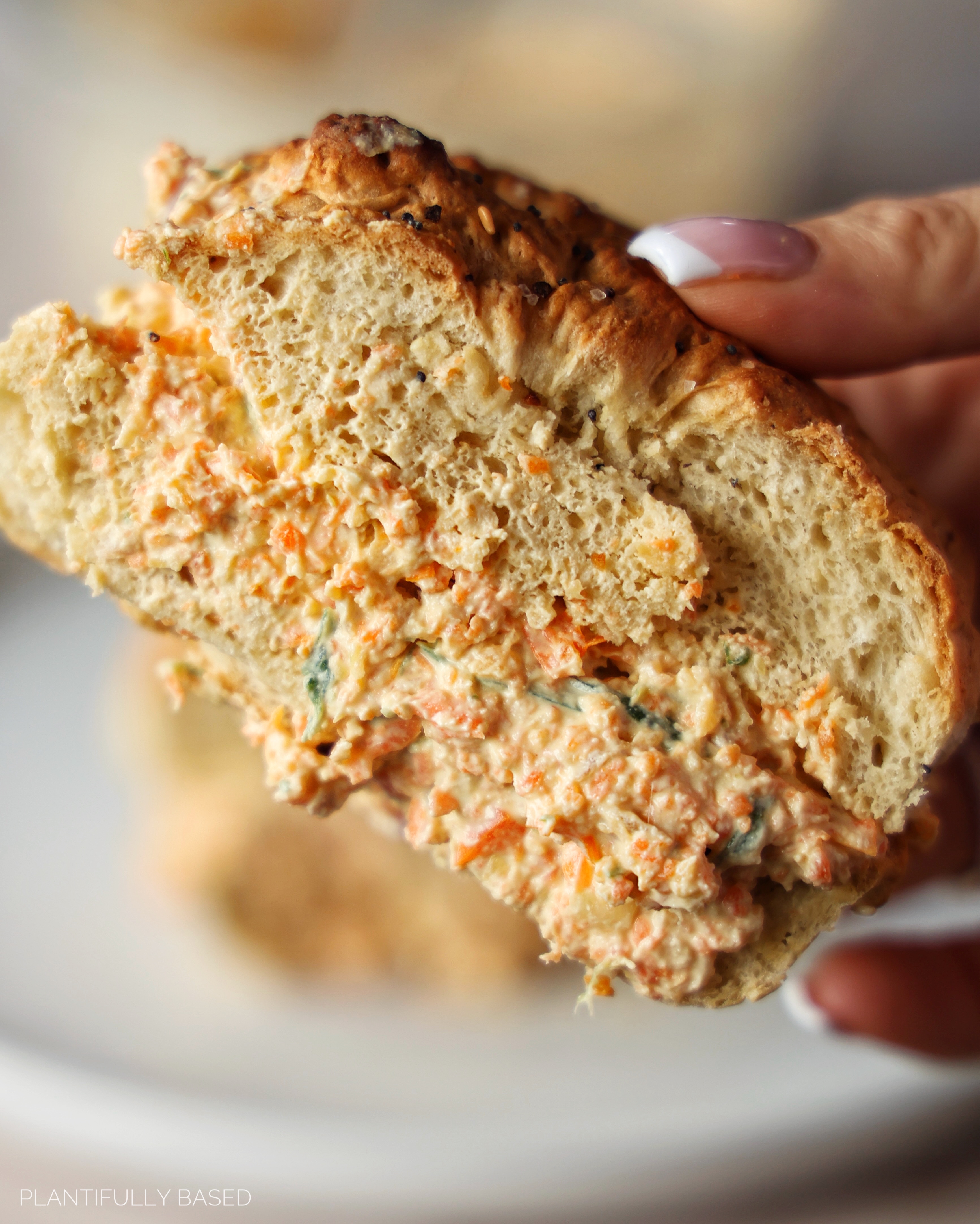 image of vegan veggie cream cheese on a bagel