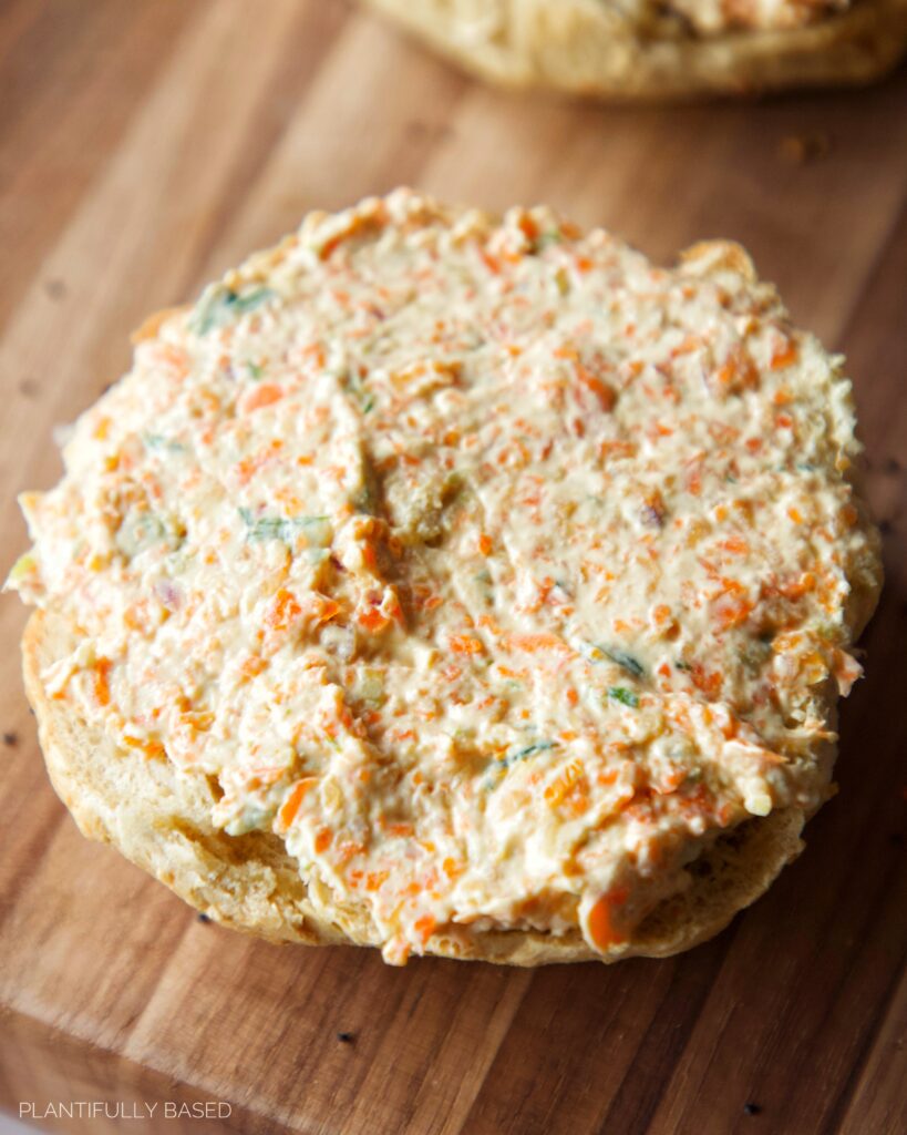 image of vegan veggie cream cheese on bagel half
