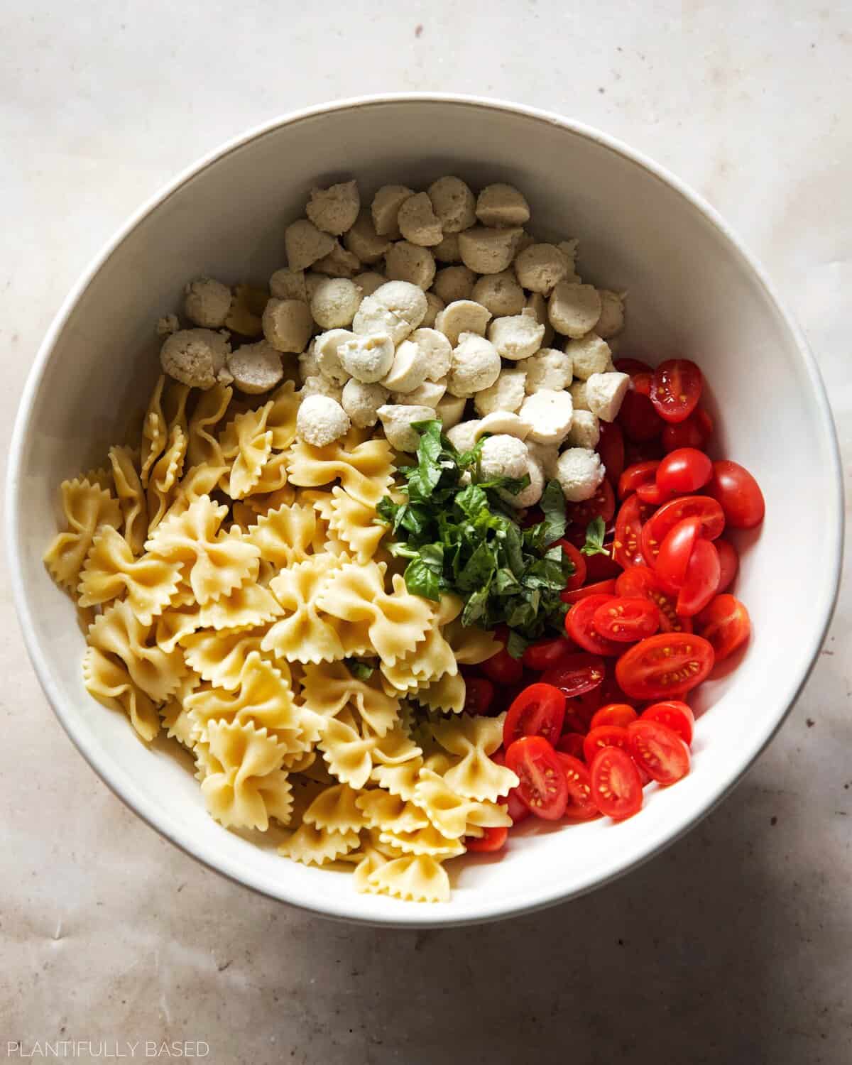 image of caprese pasta salad before mixing