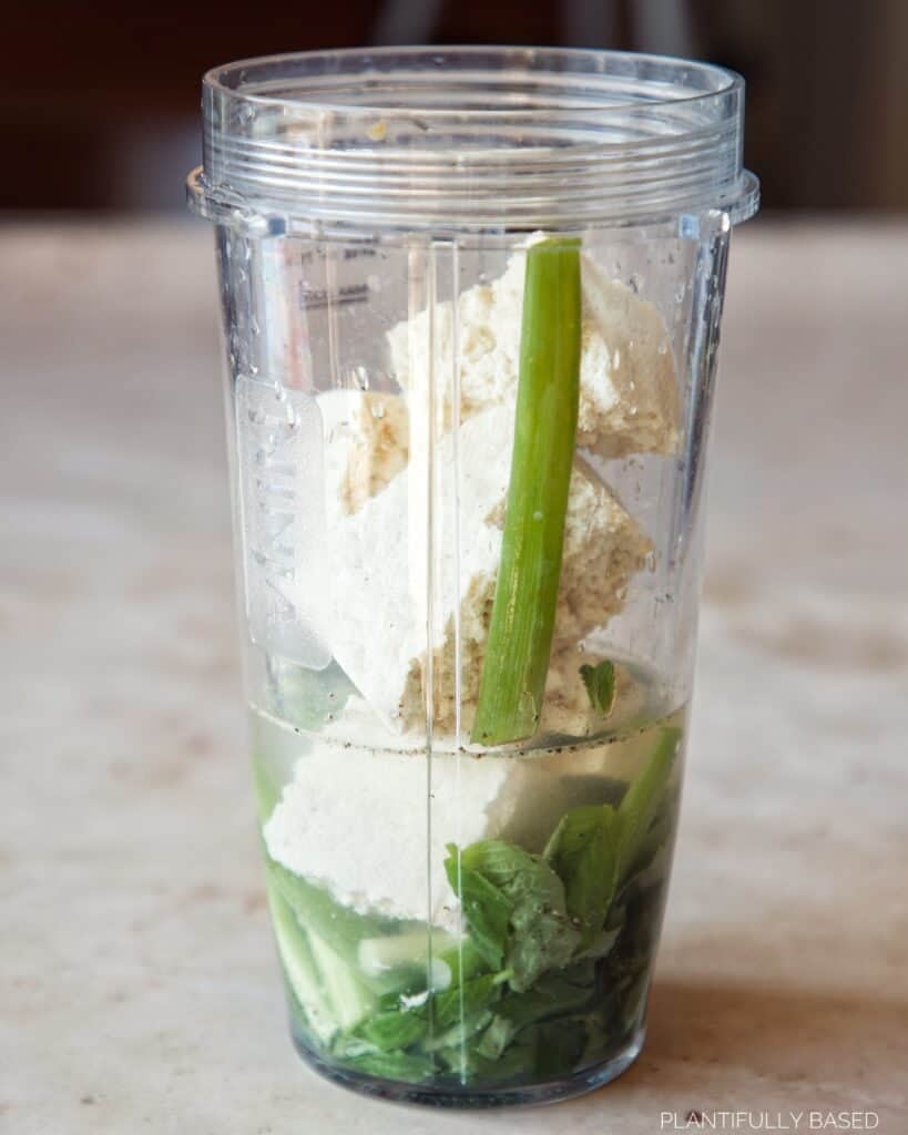 image of vegan green goddess dressing ingredients in blender