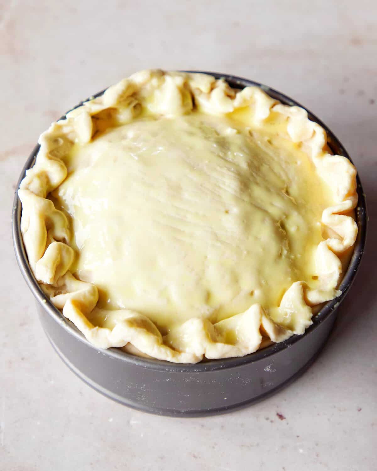 image of unbaked vegan pizza rustica