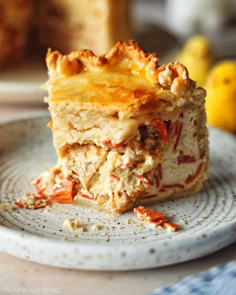 image of vegan pizza rustica with bite taken out