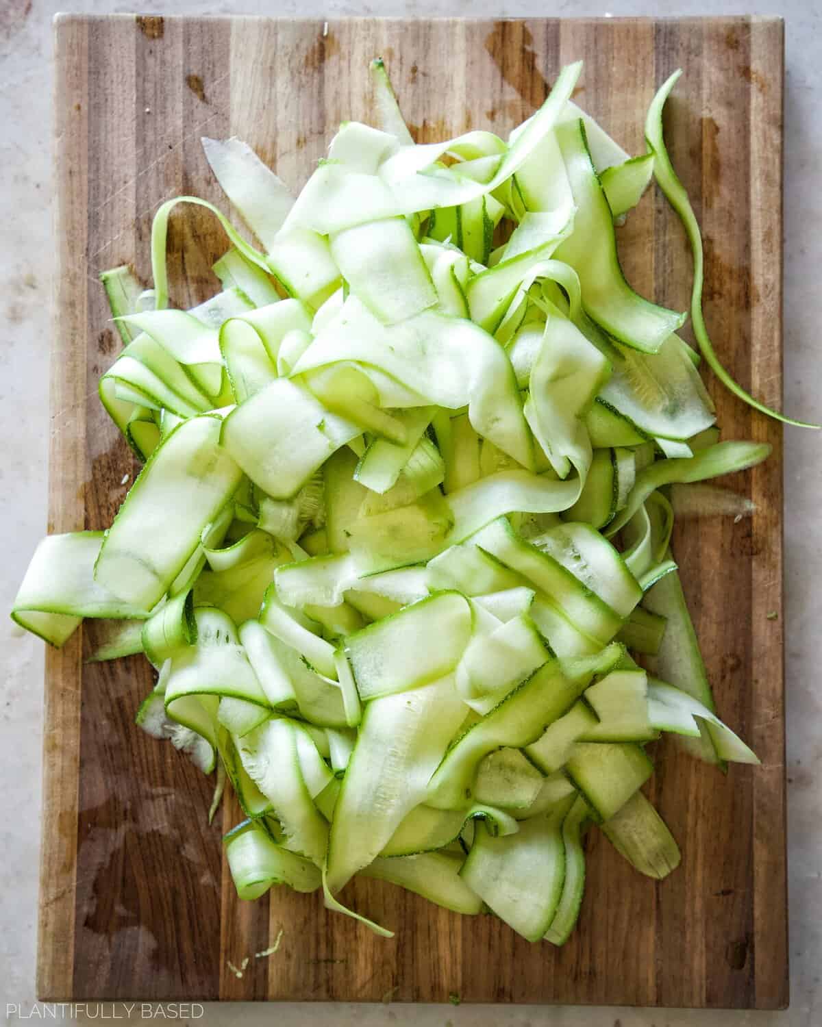 zucchini ribbons for Shaved Zucchini Caesar Salad (Vegan)