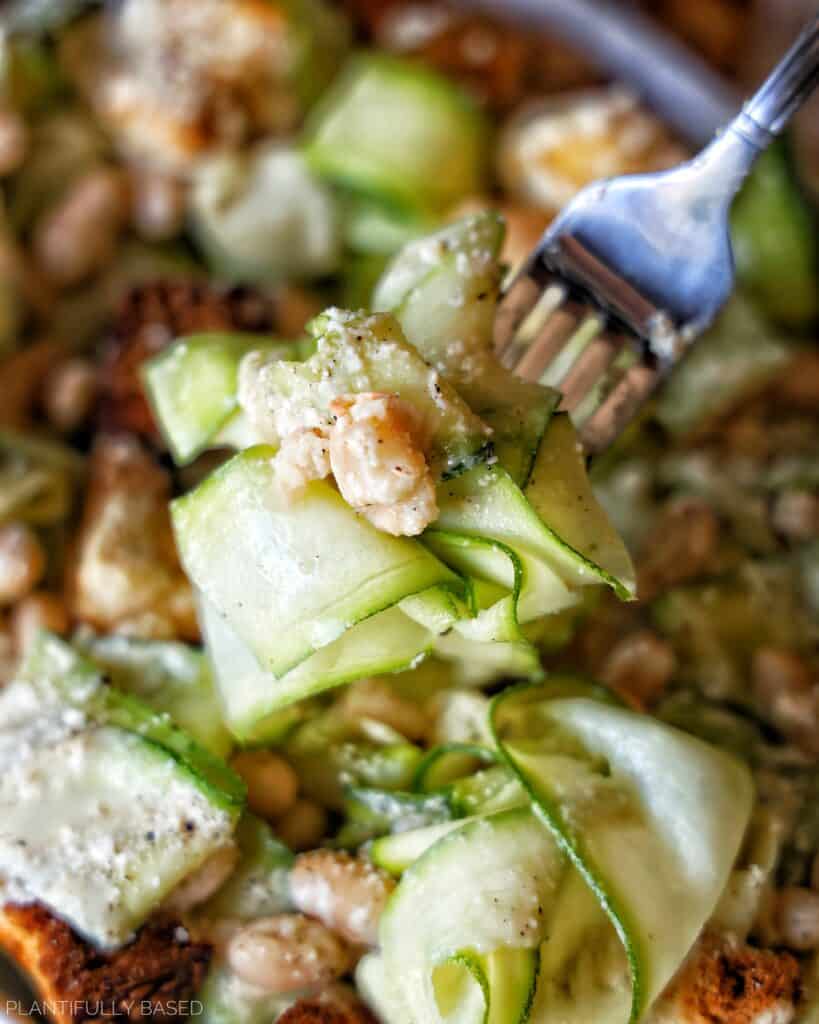 forkful of Shaved Zucchini Caesar Salad (Vegan)