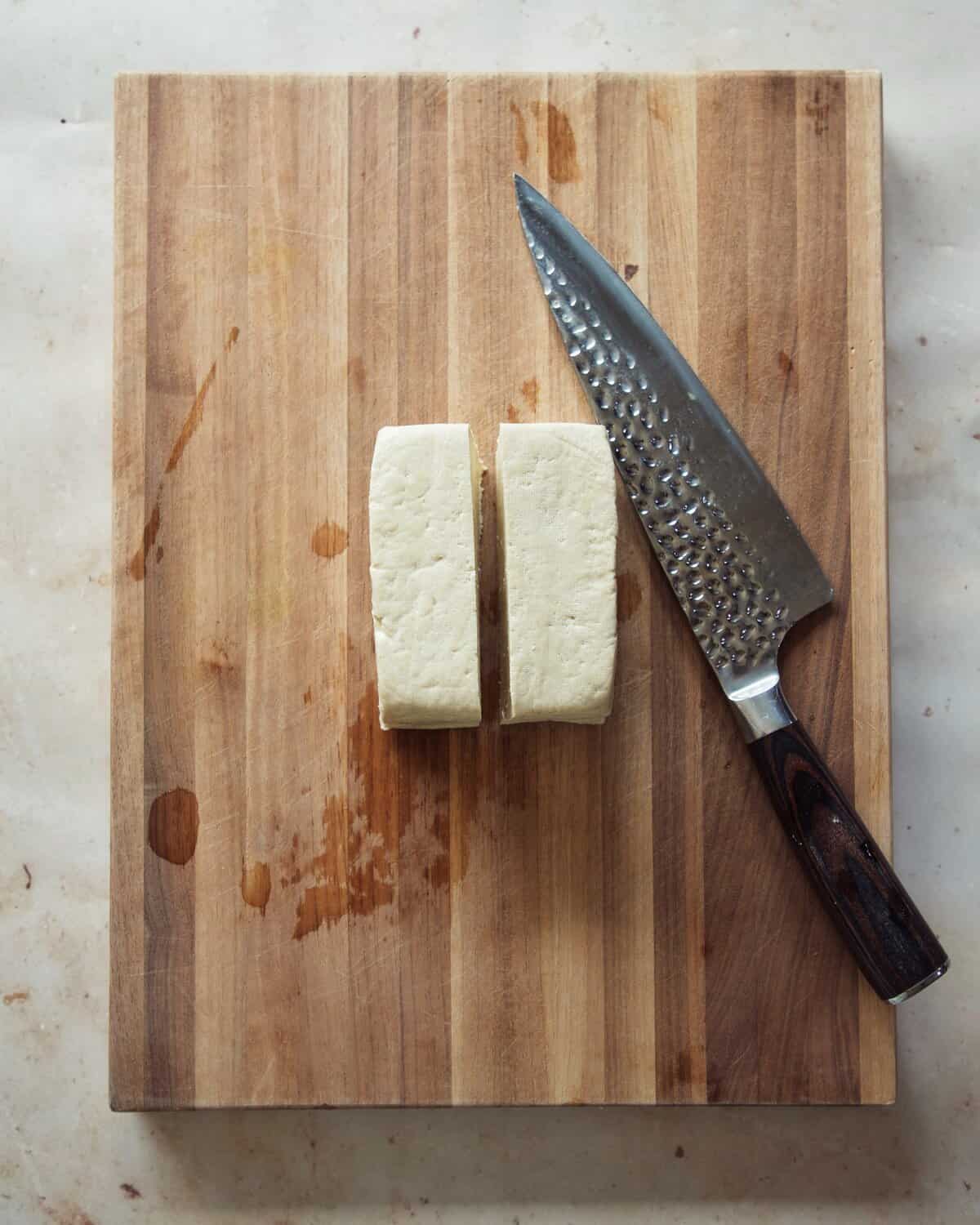 full block of tofu cut in half for tofu bacon