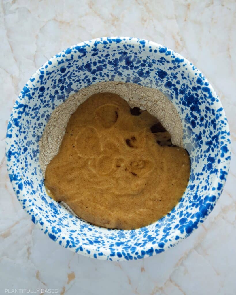 wet ingredients in a bowl with dry ingredients