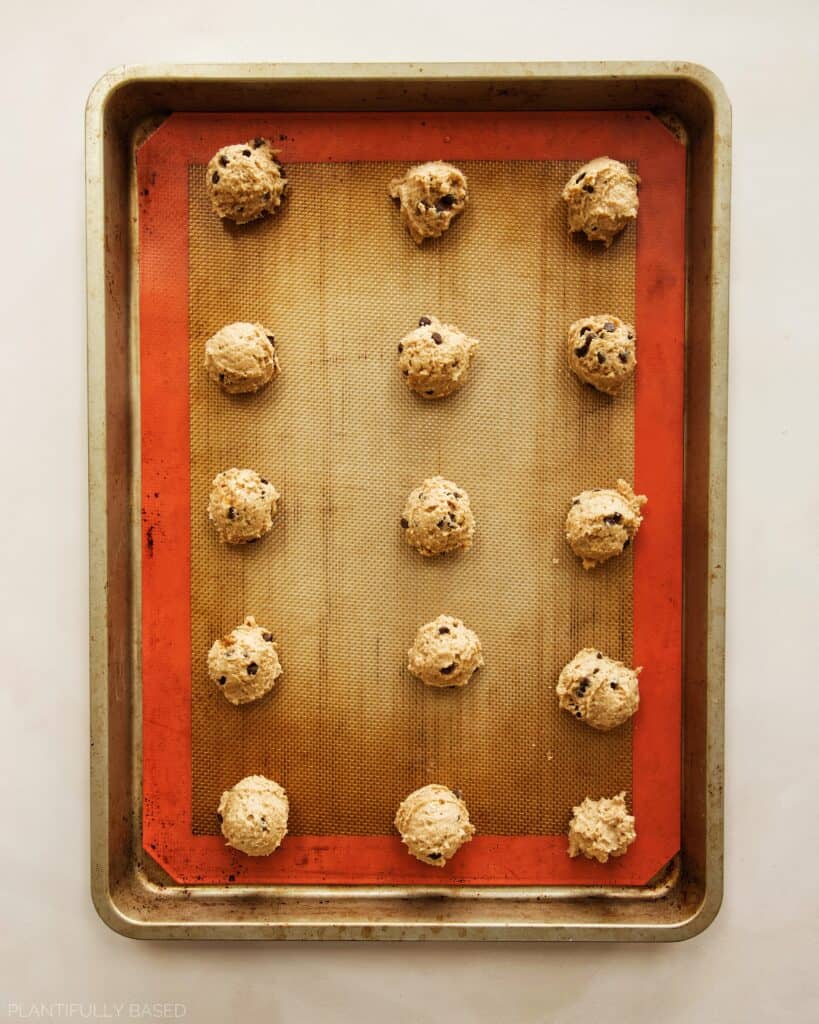 image of Tofu Chocolate Chip Cookies made with Silken Tofu cookies scooped out on baking sheet