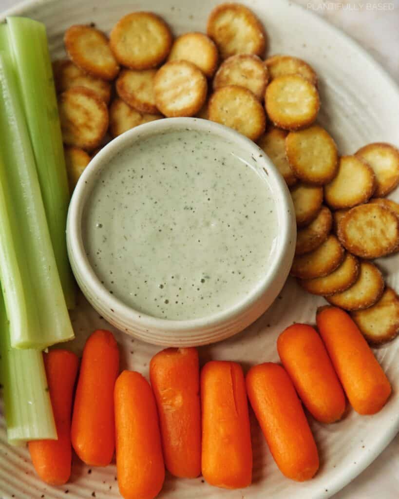vegan ranch dressing with celery, carrots, and crackers