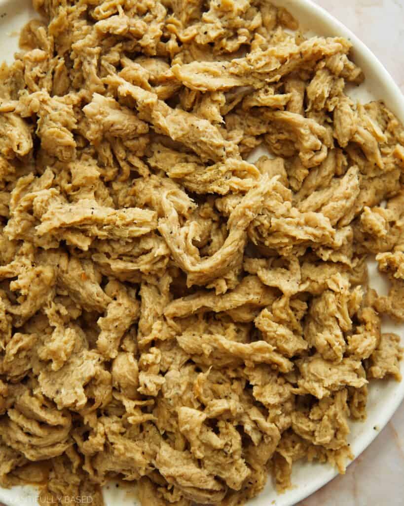 shredding the seitan to make vegan shredded chicken