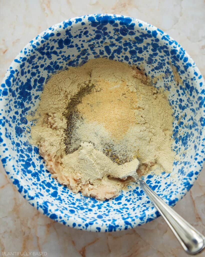 adding dry ingredients to beans