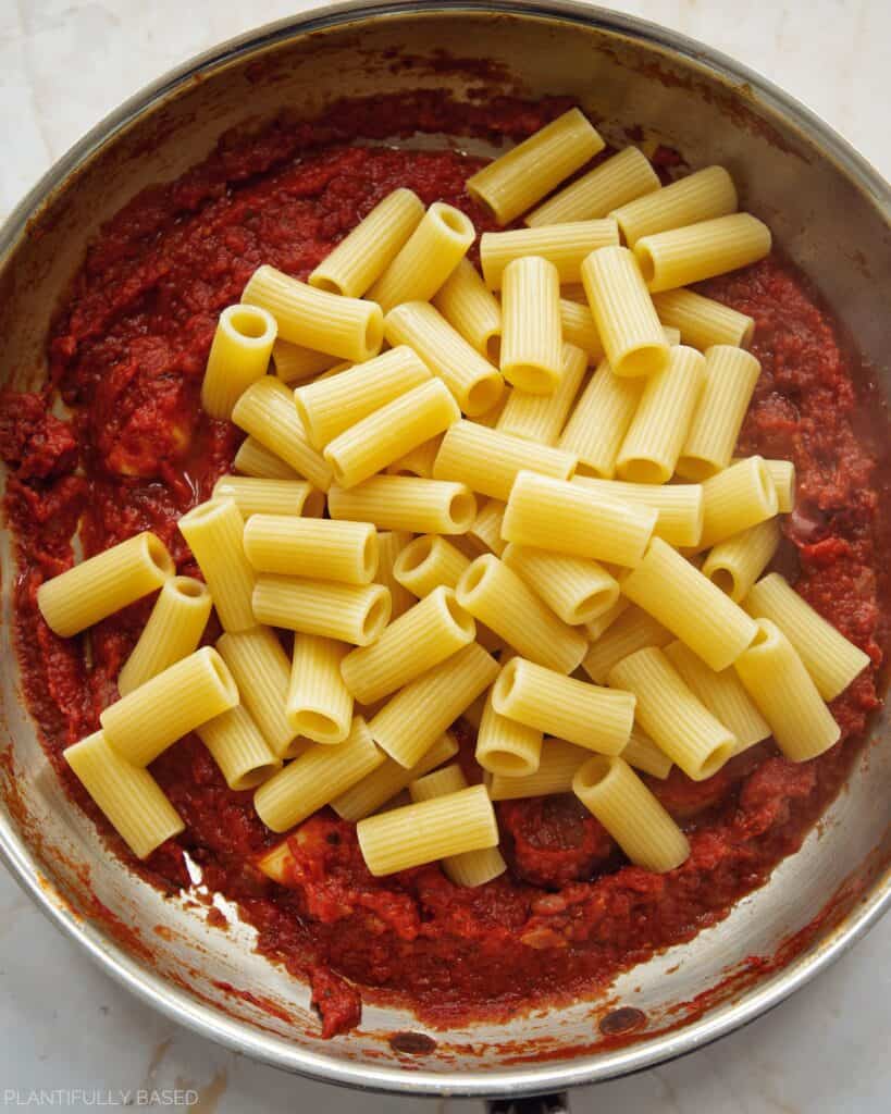 rigatoni in the arrabbiata sauce before mixing