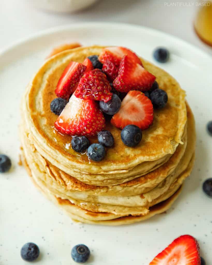 stack of high protein pancakes with fruit