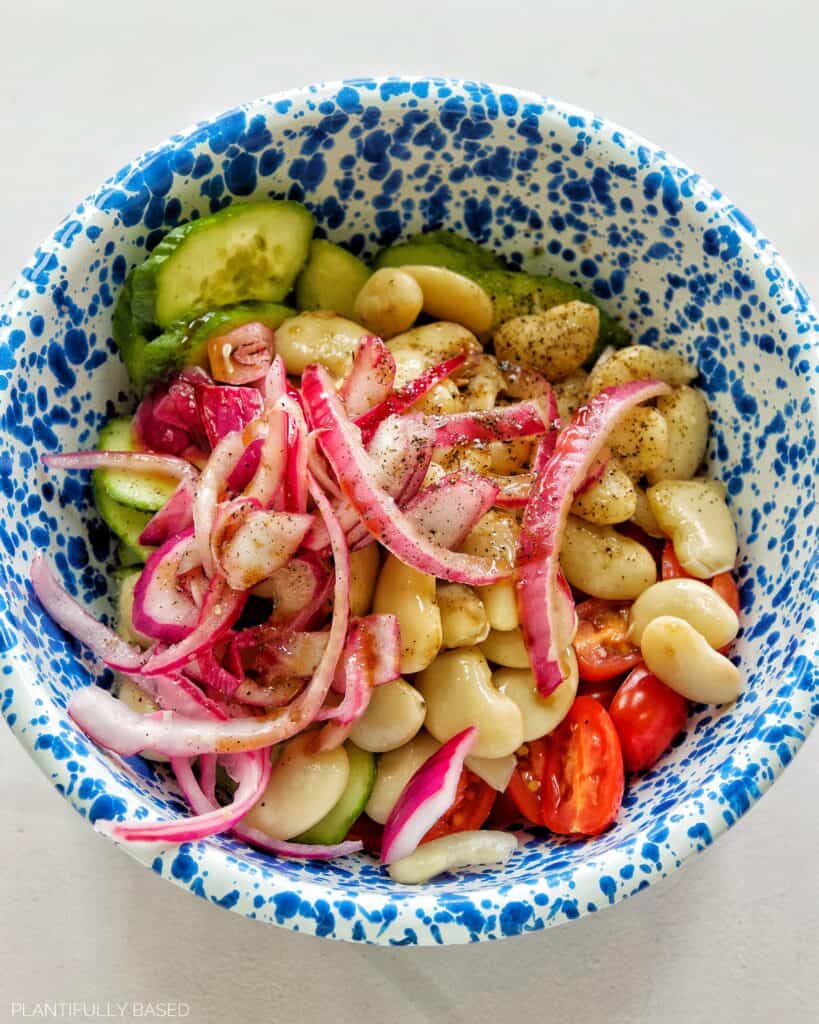 red onion, beans, and dressing for butter bean salad