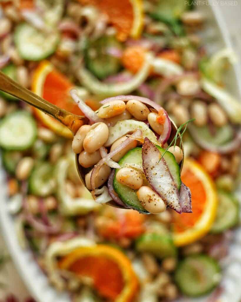 scoop of orange and white bean salad