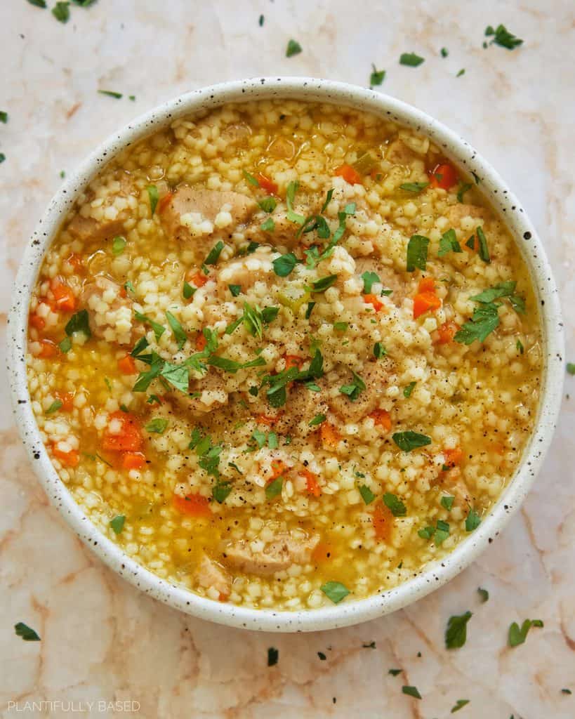 vegan chicken soup in a bowl birdseye